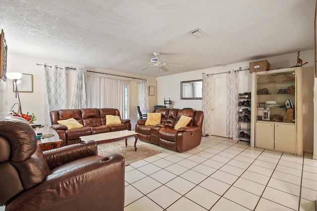 1801 SW Beeker St S, Port Saint Lucie, FL 34953 - living area with a ceiling fan, light tile patterned flooring, and a textured ceiling