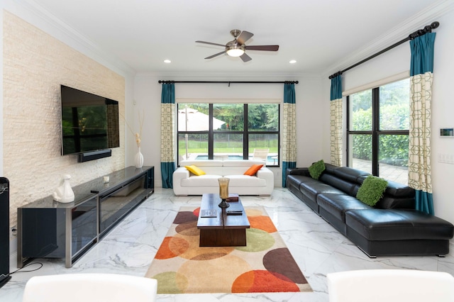 living room with ornamental molding, ceiling fan, and a healthy amount of sunlight