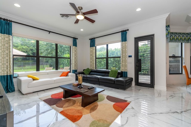 living room featuring ceiling fan, a healthy amount of sunlight, and ornamental molding