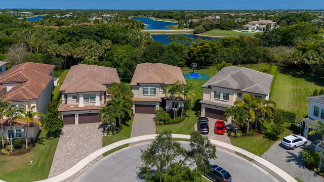 birds eye view of property with a water view