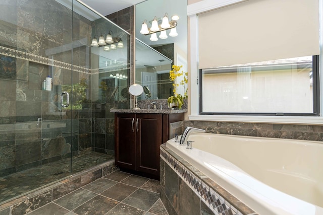 bathroom featuring vanity and separate shower and tub