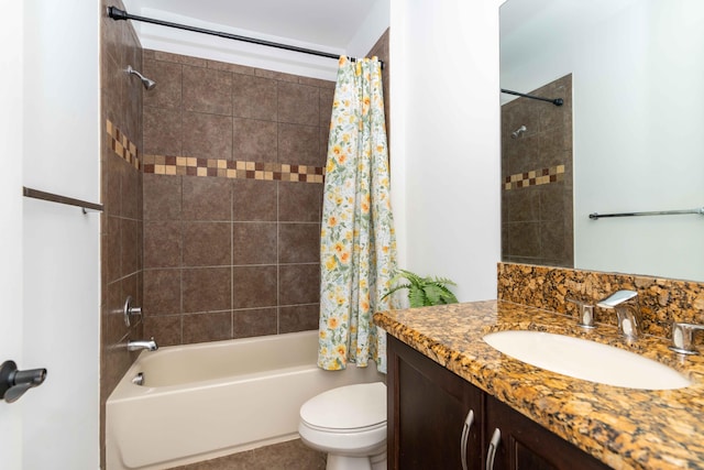 full bathroom featuring vanity, shower / bath combo, and toilet