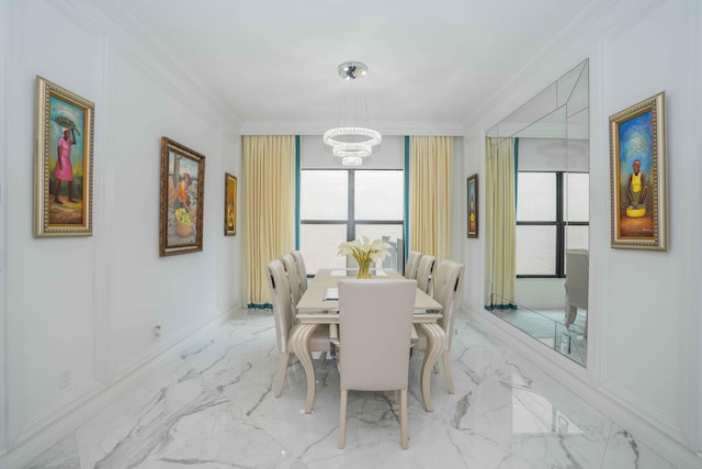 dining space with a notable chandelier, ornamental molding, and a wealth of natural light