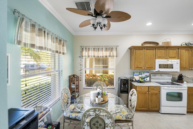 kitchen featuring ceiling fan, white appliances, ornamental molding, and light tile patterned floors