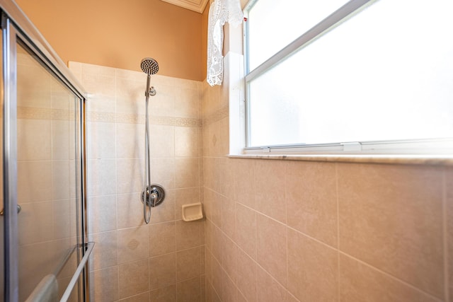 bathroom with tiled shower