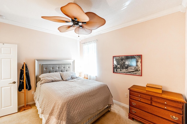 bedroom with ceiling fan, crown molding, and light carpet