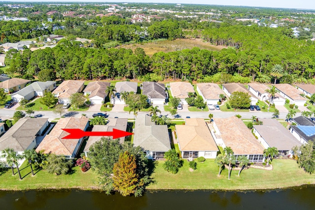 birds eye view of property featuring a water view