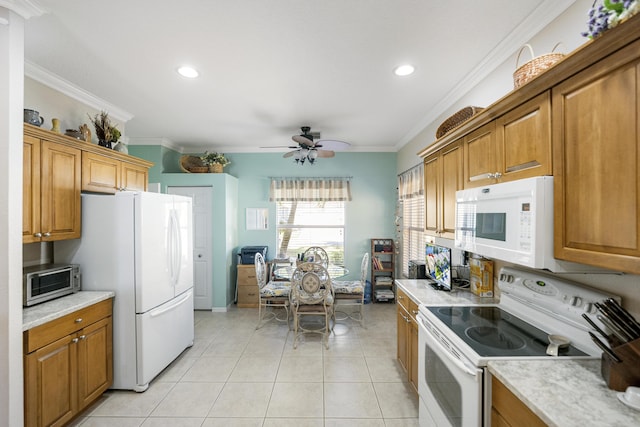 kitchen featuring white appliances, ceiling fan, crown molding, and light tile patterned flooring