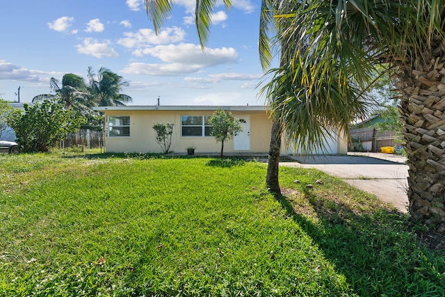 ranch-style home with a front lawn