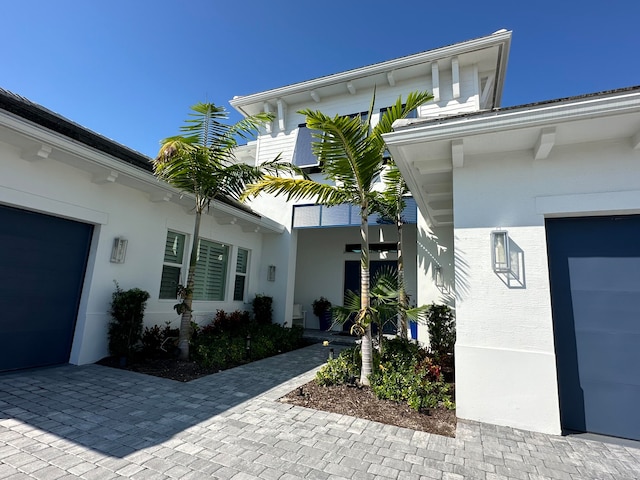 doorway to property featuring a garage