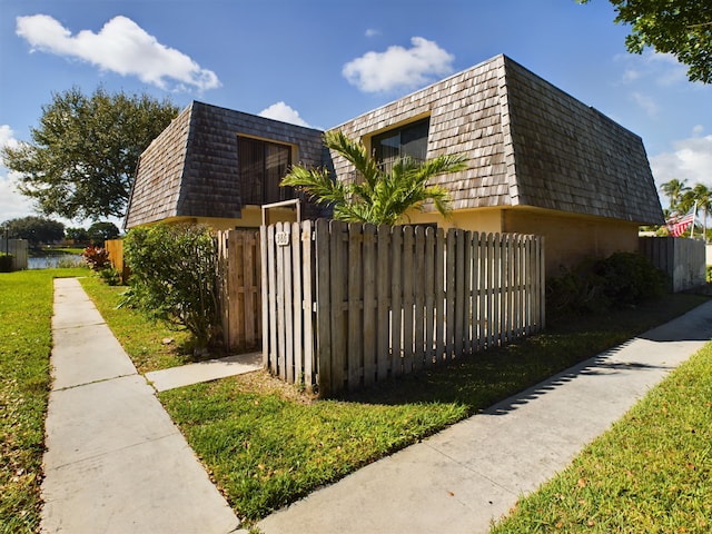 view of home's exterior featuring a water view