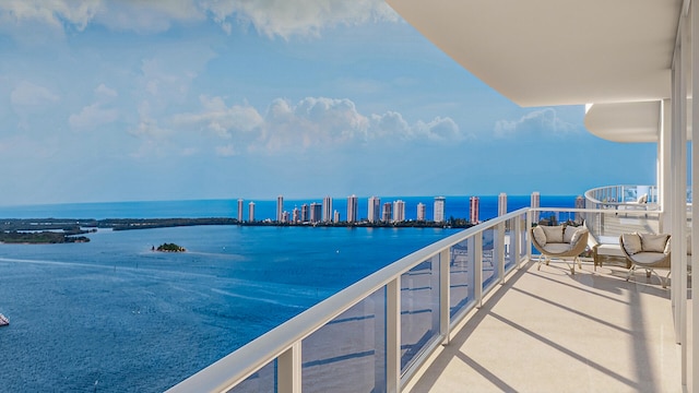 balcony featuring a water view