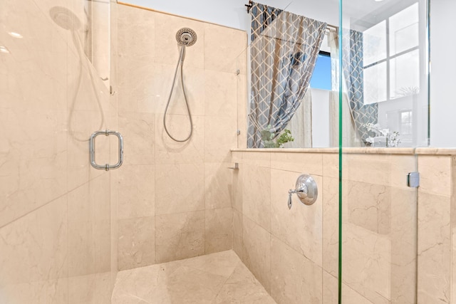 bathroom featuring an enclosed shower