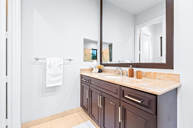 bathroom featuring tile patterned flooring and vanity