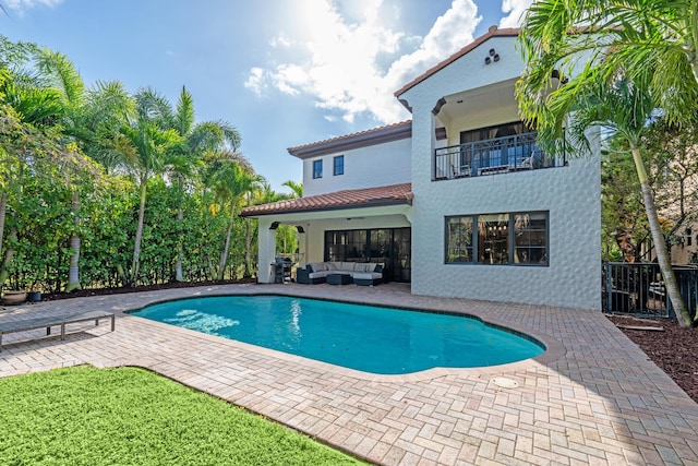 view of pool featuring area for grilling, a patio, and an outdoor hangout area