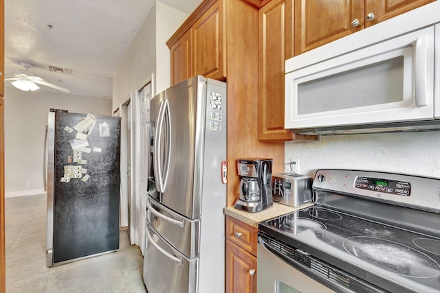 kitchen with ceiling fan and appliances with stainless steel finishes