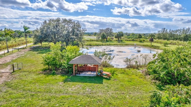 aerial view with a water view and a rural view