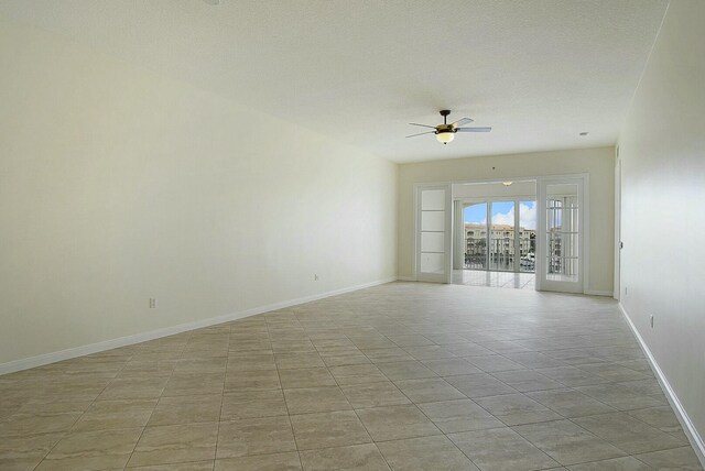 spare room with ceiling fan