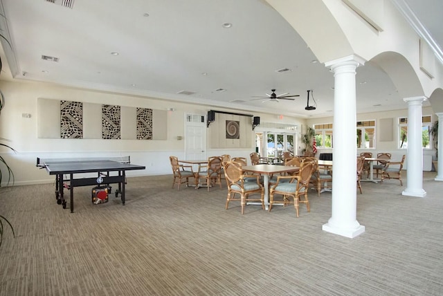 dining space with carpet, ceiling fan, and ornamental molding