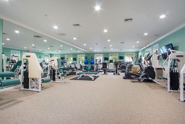 gym with light colored carpet and crown molding