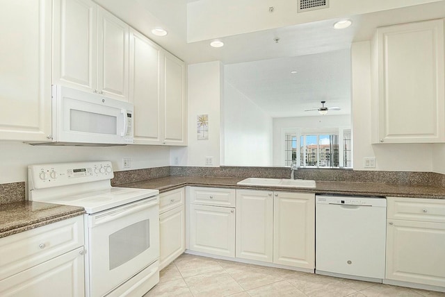 kitchen featuring white cabinets, white appliances, and sink