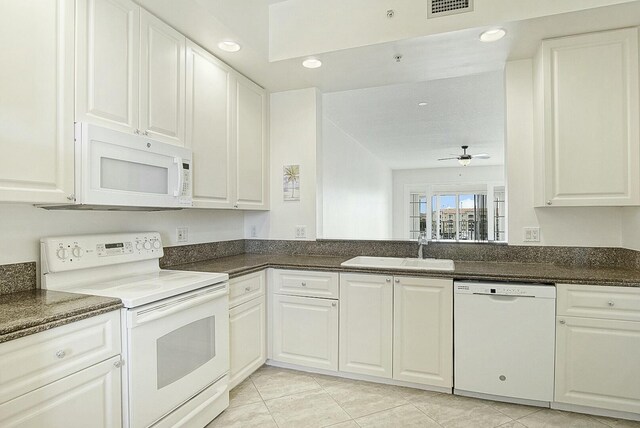 unfurnished room featuring ceiling fan, light tile patterned floors, and a textured ceiling