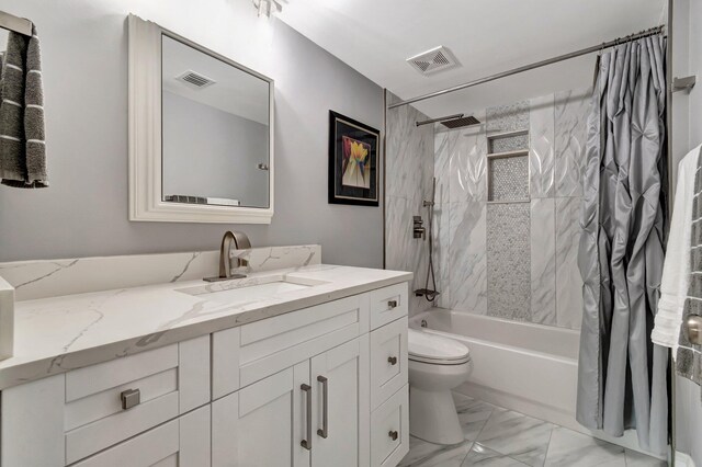 full bathroom with vanity, toilet, and shower / bath combo