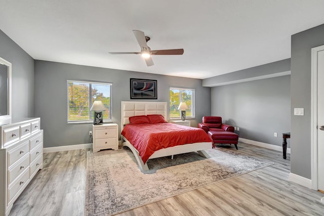 bedroom featuring ceiling fan and light hardwood / wood-style flooring