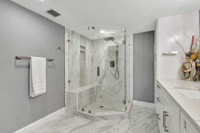 bathroom with vanity and an enclosed shower