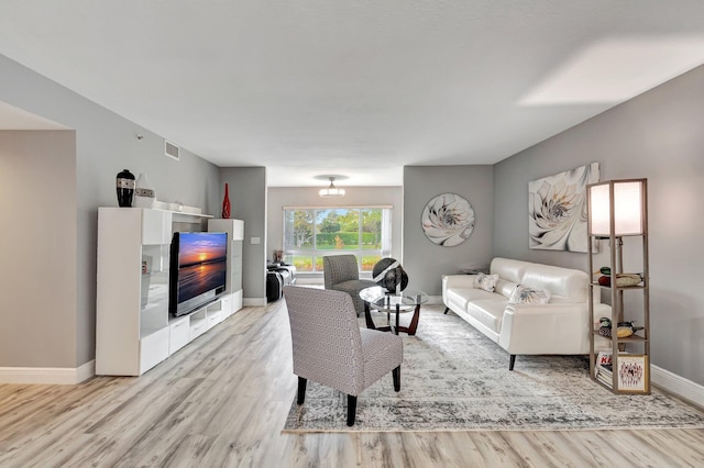 living room with light hardwood / wood-style floors