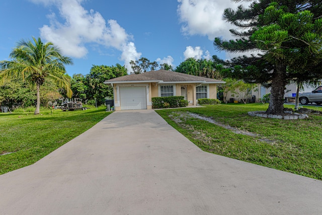 view of front of property with a front yard and a garage