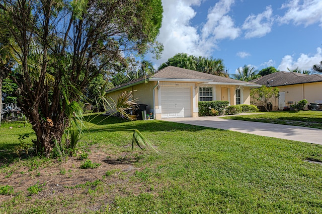 single story home featuring a front yard and a garage