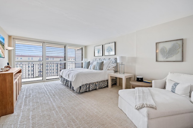 carpeted bedroom featuring access to exterior