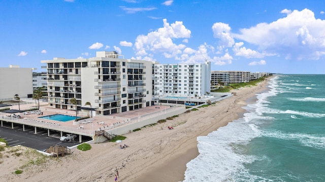 aerial view featuring a water view and a view of the beach