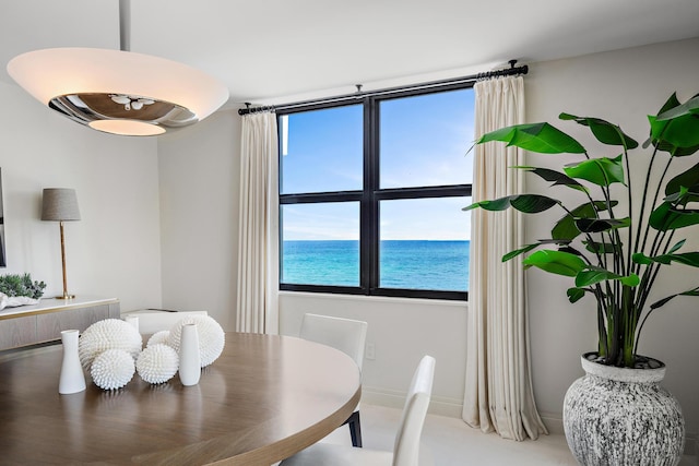 dining room with a water view