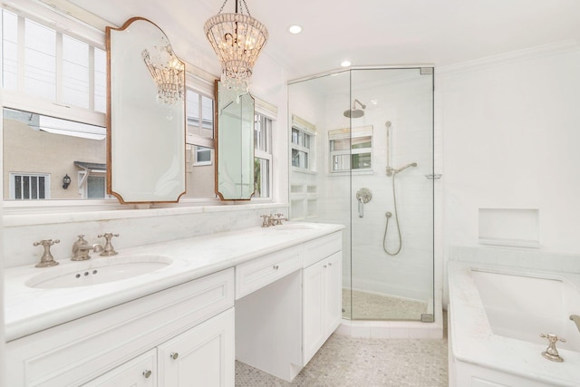 bathroom with vanity, crown molding, a shower with shower door, and a notable chandelier