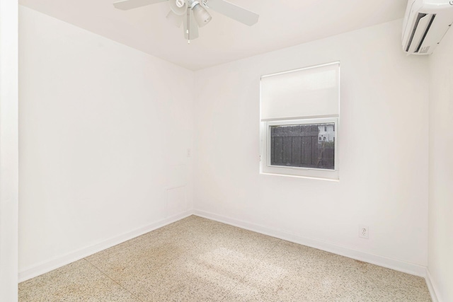 unfurnished room featuring a wall mounted air conditioner and ceiling fan