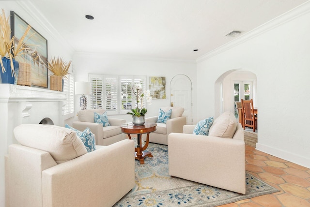 living room with ornamental molding and a wealth of natural light