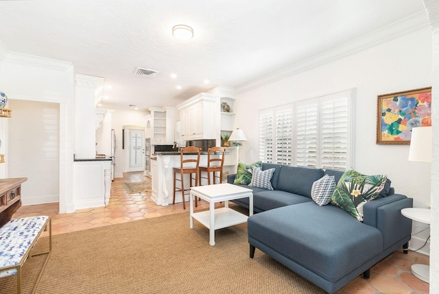 living room featuring crown molding