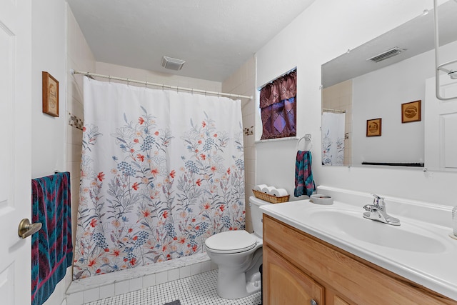 bathroom with toilet, vanity, a shower with curtain, and tile patterned floors