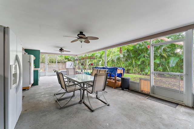 sunroom / solarium featuring ceiling fan