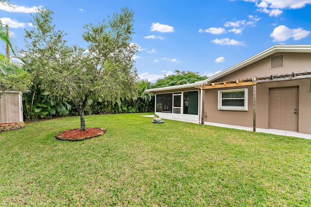 view of yard featuring a sunroom