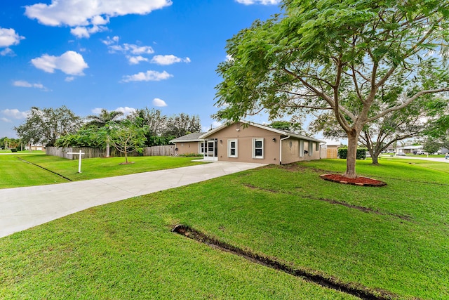 single story home featuring a front yard