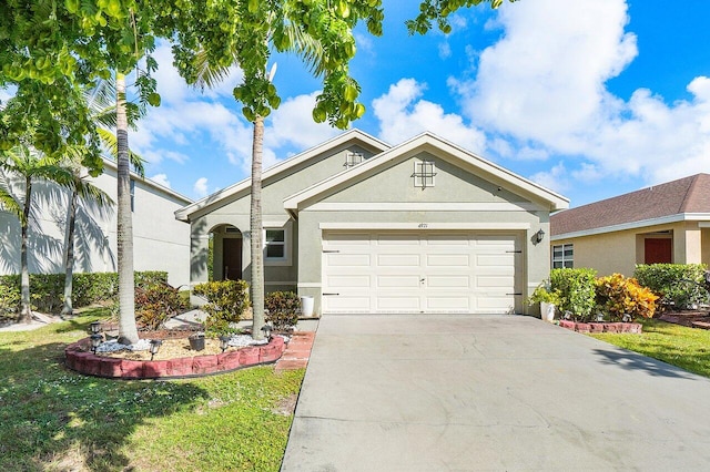 view of front of property featuring a garage and a front yard