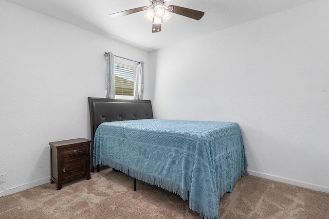 bedroom with light colored carpet and ceiling fan