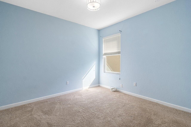 unfurnished room featuring carpet floors