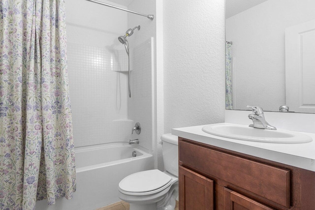 full bathroom featuring shower / bath combo with shower curtain, vanity, and toilet