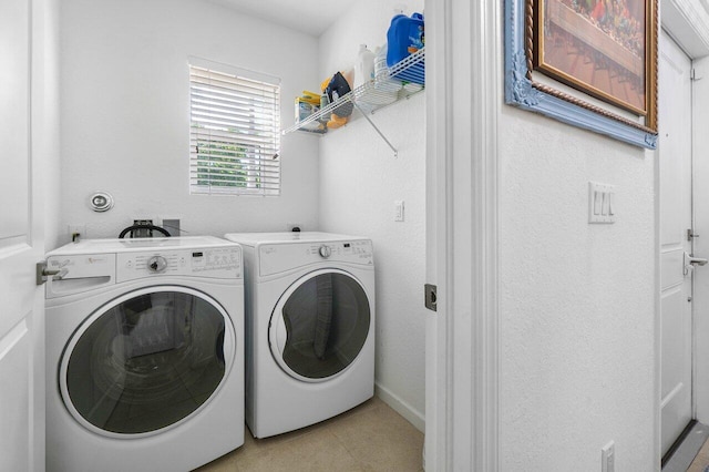 laundry room with washing machine and clothes dryer