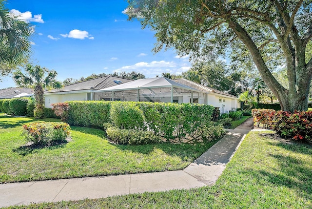 view of side of home featuring a lawn