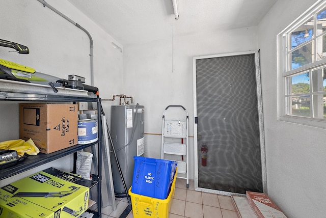 utility room featuring electric water heater